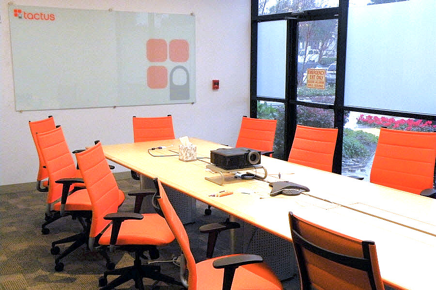 Tech Firm Conference Room, Custom Table with Power, Watermarked Glassboard, Logo Colored Chairs