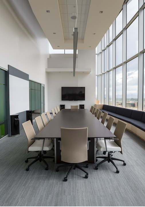 Modern Executive Conference Room, White Glass Markerboard, Display Monitor and Staff Seating