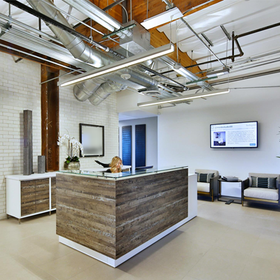 Custom Reception Desk with Unique Finishes, Glass Countertop, and Matching Credenza